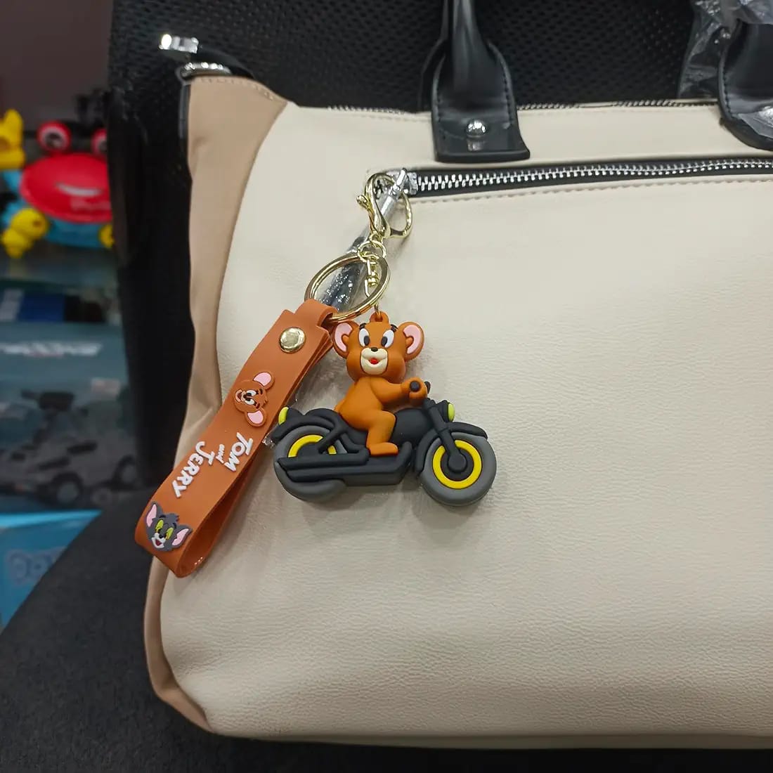 Tom And Jerry On Bike Silicon Keychain With Bagcharm And Strap (Select From Drop Down Menu)