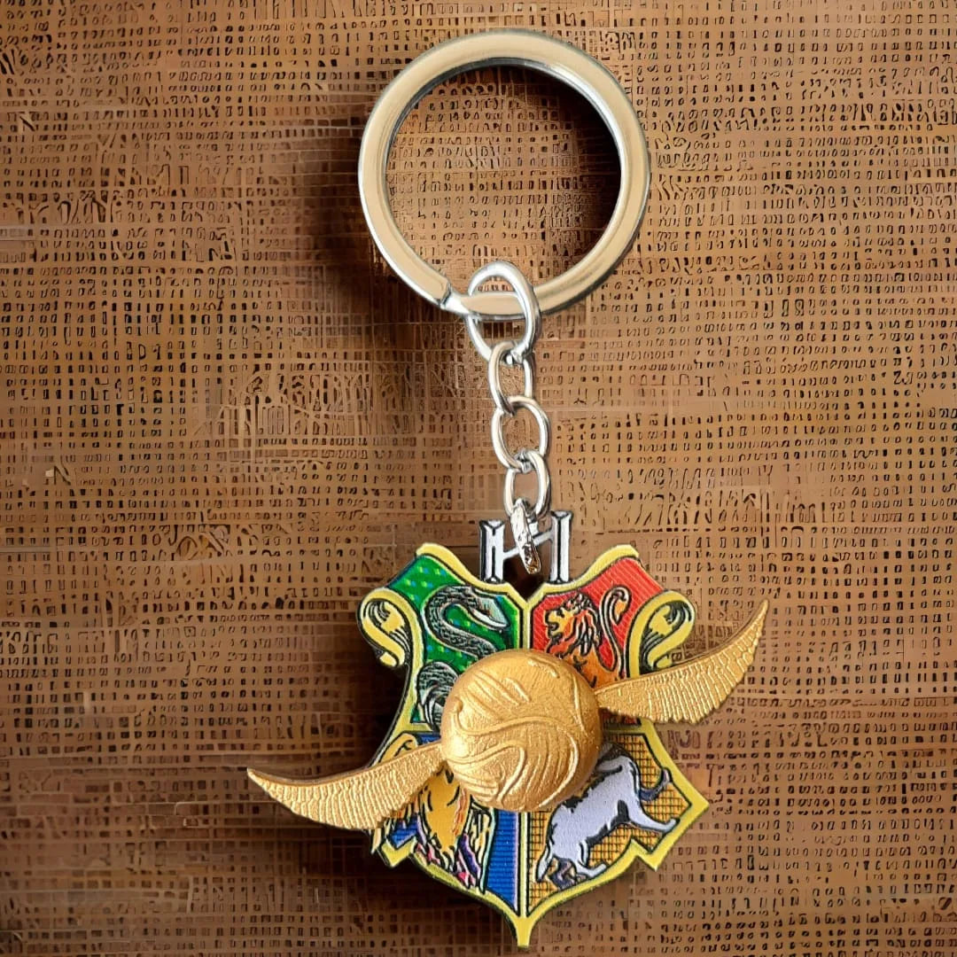 Harry Potter Quidditch Snitch On Hogwarts House Crest Rotating Keychain with Bagcharm